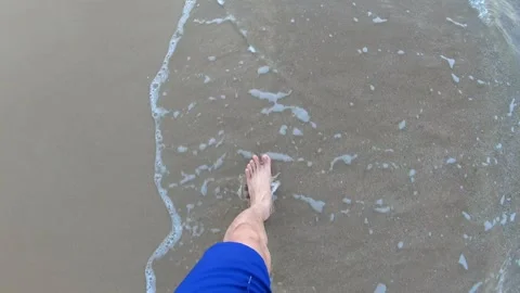 Walking on the Beach Shoreline with Waves Stock Footage 313918349