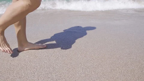 Walking on the beach in slow motion. Stock Footage 212509355