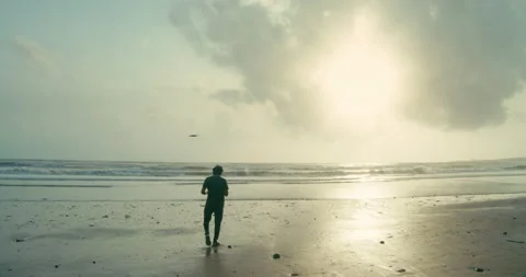 Walking at beach on a sunset Stock-Footage 133325514