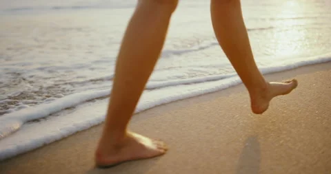 Walking the Beach at Sunset Stock Footage 153390265