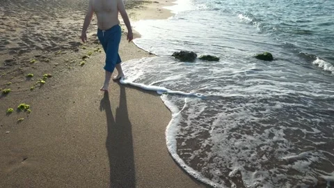 Walking on the beach, sunset Stock Footage 218387996