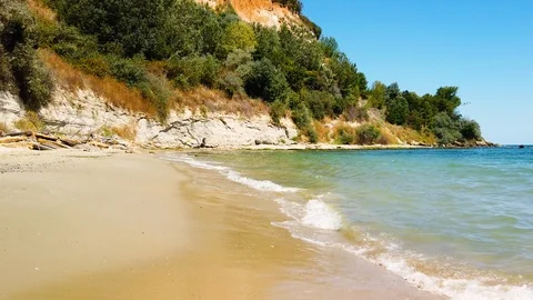 Walking on the beautiful desolate beach with turquoise water and golden sands Stock Footage 117355477