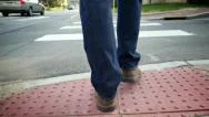 Walking Behind Man Crossing Street Low Pov Stock Footage