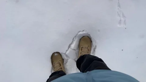 Walking in Beige Winter Boots on Fresh Puffy Snow Stock Footage 322086582