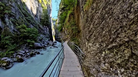 Walking Beside Turquoise River Through Narrow Rocky Gorge Stock Footage 344878273