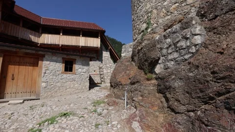 Walking Between Ancient Structures at the Old Castle Žovnek Stock Footage 282671819