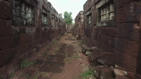 Walking in between Ankor Temple in cambodia, antique and historic sight in a Stock Footage 145299073