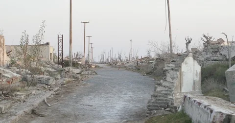 Walking between constructions rubble and ruins at destroyed and abandoned city 스톡 동영상 126311710