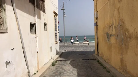 Walking between old house in Larnaca with view the Sea Stock Footage 89619107