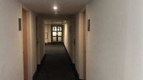 Walking Between Rooms In A Hotel Corridor Video stock 169577857