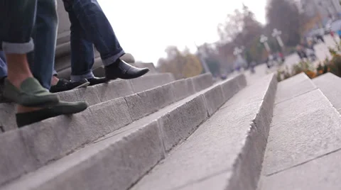 Walking boys. men go down the stairs Stock Footage 34654114