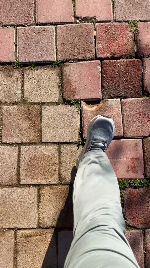 Walking on a brick path for fitness, a healthy living concept Stock Footage 332334603