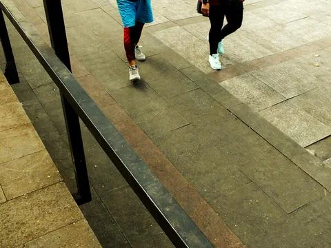 Walking on Brick Pathway Stock Photos