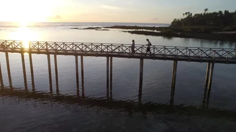 Walking in the bridge during sunrise at Cloud 9 Siargao Island Video stock 299242972