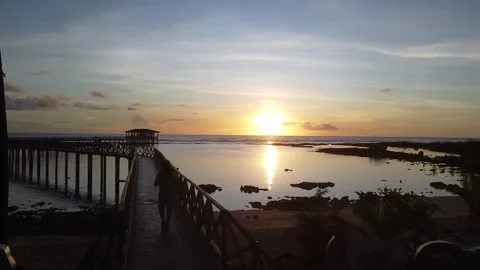 Walking in the bridge during sunrise at Cloud 9 Siargao Island Video stock 299243461