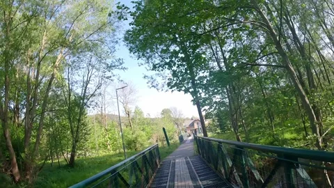 Walking on bridge over river Stock Footage 297371120