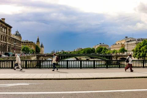 Walking on the bridge over The Seine River in Paris, France Stock Photos