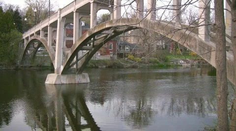 Walking bridge with reflection in river Stock Footage 401490