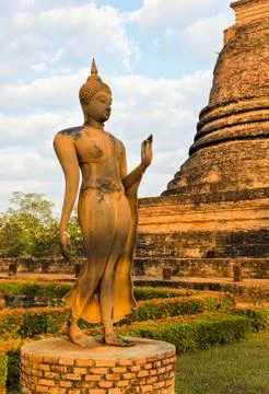 Walking buddha statue Stock Photos