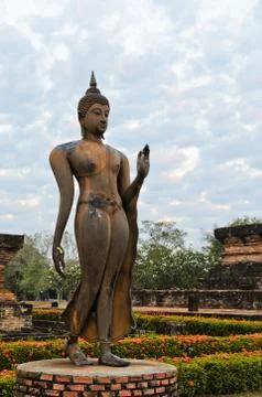 Walking buddha statue Stock Photos