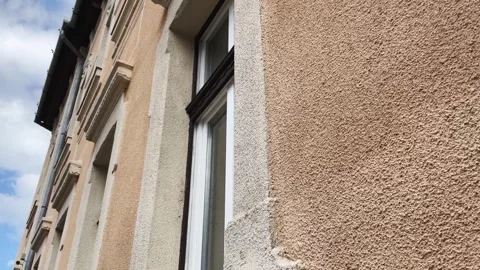 Walking by a building 库存影片 260345739