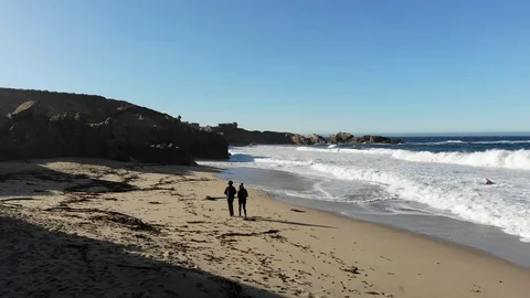 Walking on california beach drone Stock Footage