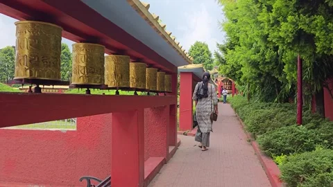 Walking the Circle: A Journey Through the Round Buddha Temple Stock Footage 317070506