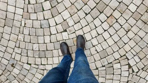 Walking on a circular stone path Stock Photos