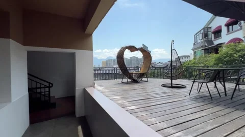 Walking from a city-view terrace down through a hostel, China Stock Footage 341664975