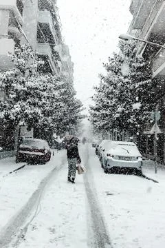 Walking In The City While Snowing Stock Photos