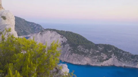 Walking on cliffs above coast line and amazing secret Beach, POV Stock Footage 77296980