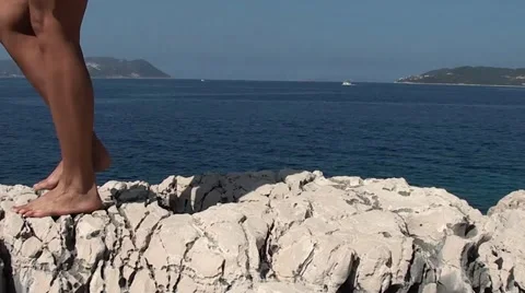 Walking on cliffs barefooted Stock Footage 11428394