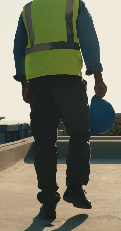 Walking, construction and back of man with helmet for building project Stock Footage 345648138