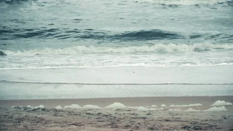 Walking Couple In front of waves Stock Footage 131098695