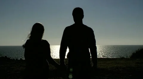 Walking Couple next to Ocean Stock Footage 10910010