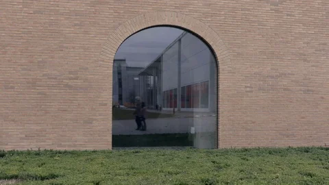 Walking couple in window reflection Stock Footage 72259750