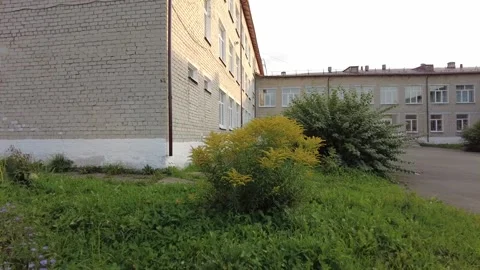 Walking in the courtyard of an old high school in Russia 動画素材 159664769