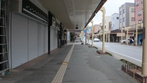 Walking on a covered sidewalk along a quiet street in Takayama, Japan Stock Footage 334056484