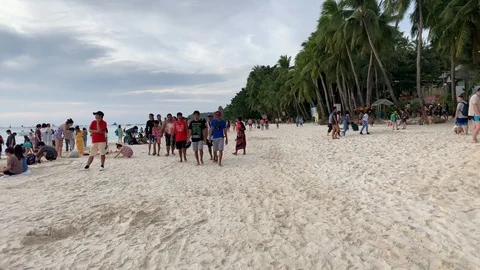 Walking on the crowded beach, Boracay, Philippines Stockbeeldmateriaal 103470345