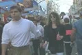 Walking with crowds of people through a street fair Footage