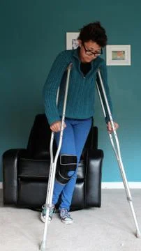 Walking On Crutches Stock Photos