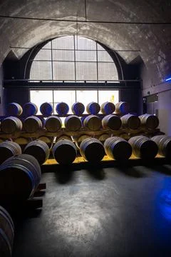 Walking in deep and long undergrounds caves with wooden barrels, making champ Stock Photos