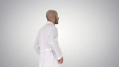 Walking doctor in a robe on gradient background. Stock Footage 115106570