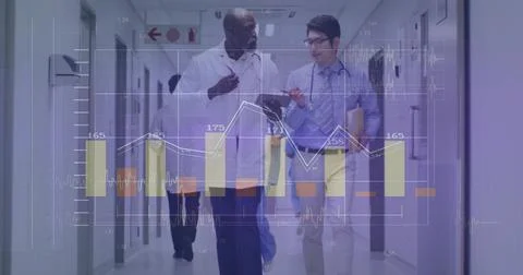 Walking, doctors in lab coat and tie reviewing tablet and folder in hospital Stock Photos