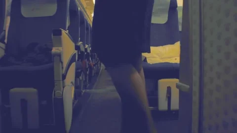 Walking down the aisle rows of seats to get off leaving from airplane Stock Footage 157966473