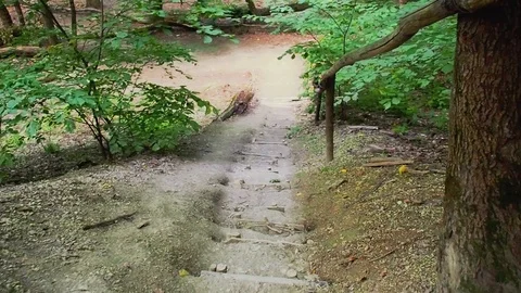 Walking down along the stairs, footpath in the mountains. First-person movement Stock Footage 115148931