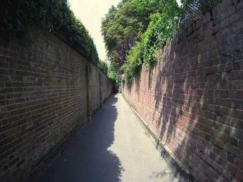 Walking down a back alley Stock Footage 79213194