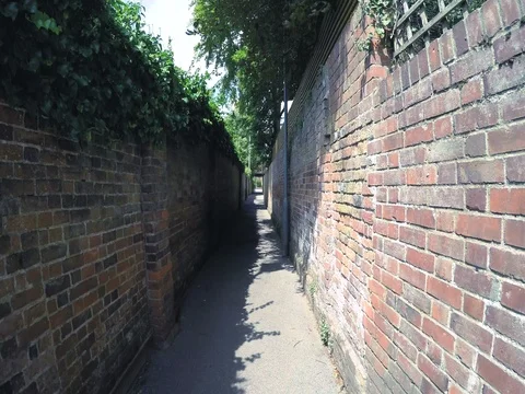 Walking down a back alley Stock Footage 79213285