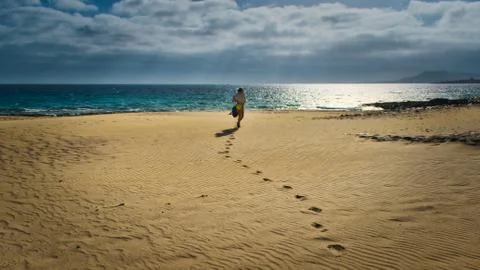 Walking down the beach Stock Photos