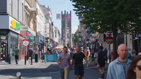 Walking down Bold Street in Liverpool on sunny day.  Stock Footage 341079380
